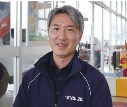 上ケ島自動車を率いる吉田一人部長