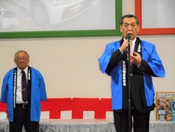 新園理事長と鹿自販中古車部会の岩﨑秀彦副部会長が登壇