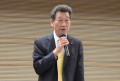 来賓あいさつを行うJU中販連・海津会長