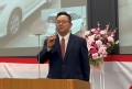 あいさつに立つ斉藤社長