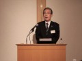 大会冒頭であいさつに立つ石川理事長