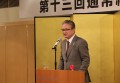 懇親会であいさつするAJ大村会長
