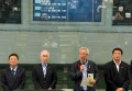 あいさつに立つ鎌田理事長（左からJU中販連・塚田会長、山田筆頭副理事長会長代行、鎌田理事長、JU福島・橋本理事長）
