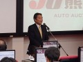 新サービス「展示車取引」を発表するＪＵコーポレーション鈴木幸昭副社長