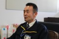 笑顔で抱負を語る菅田会場長